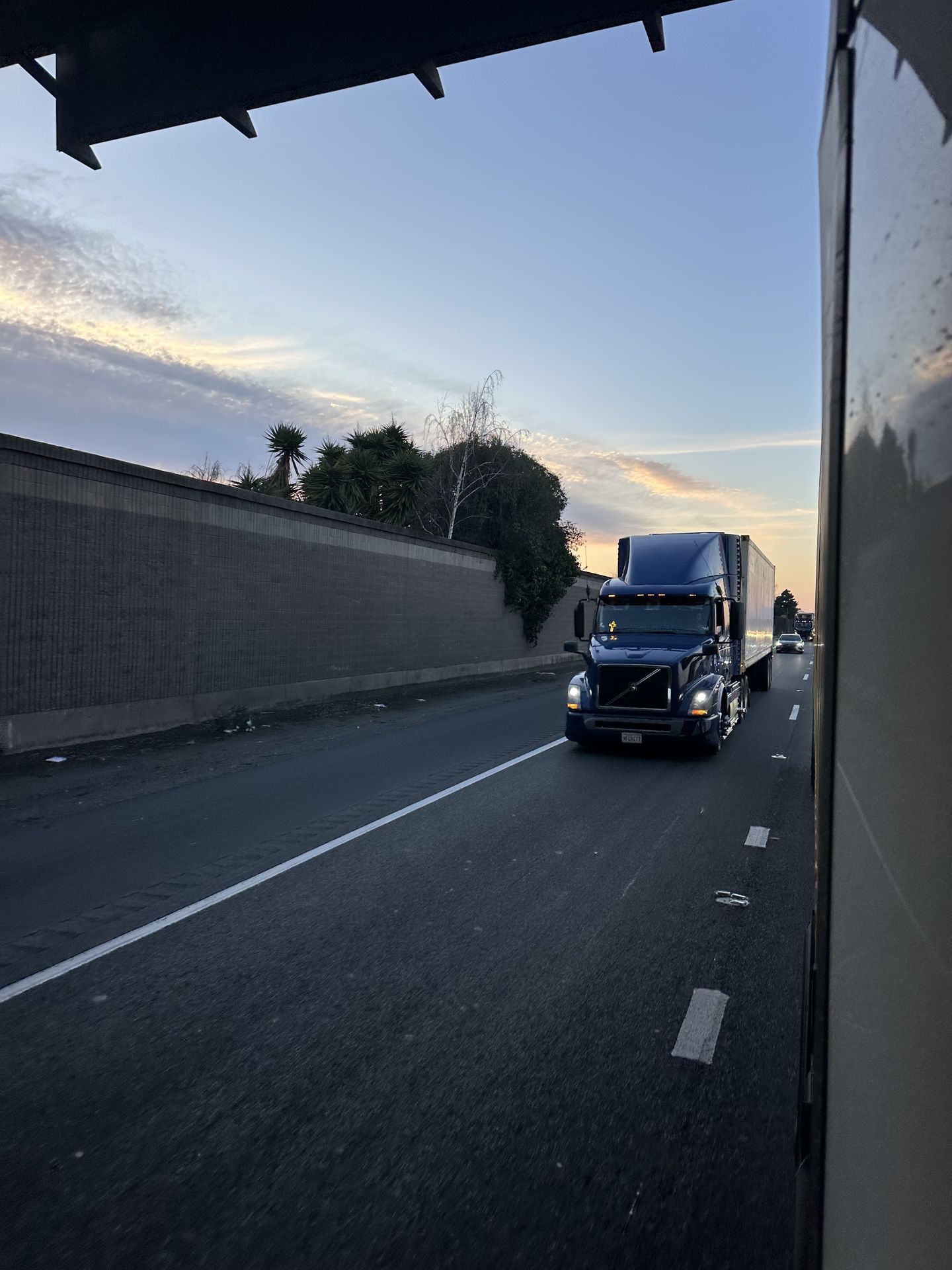 Truck on highway at sunset